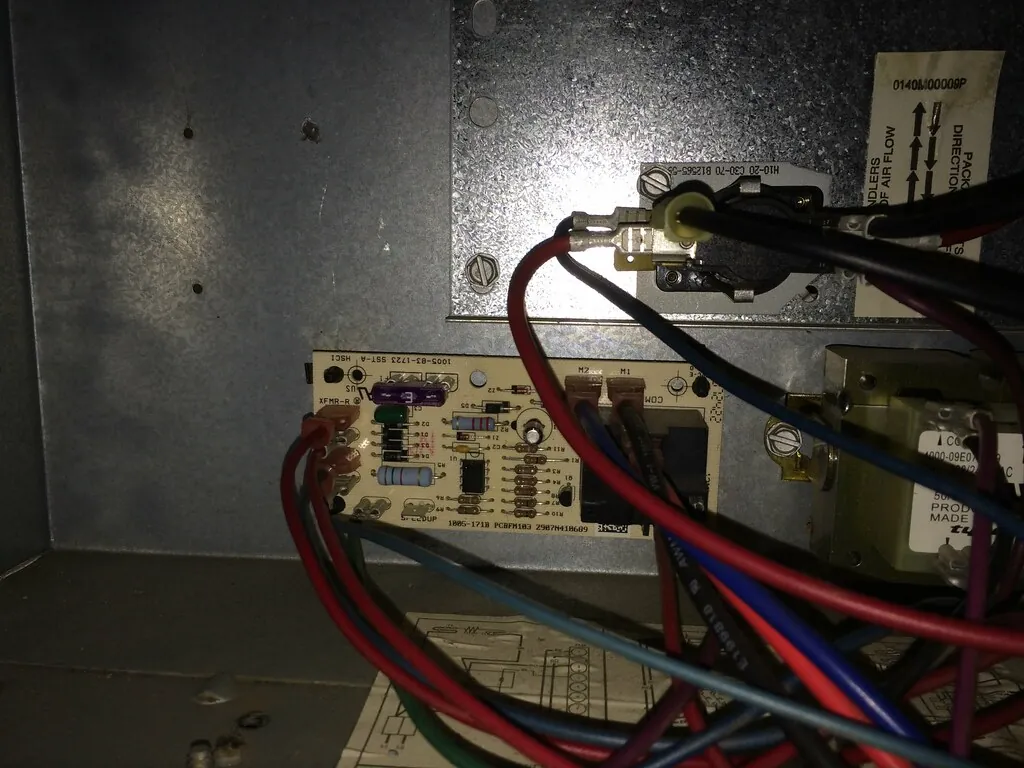 Fan control board and wiring inside an electric air handler